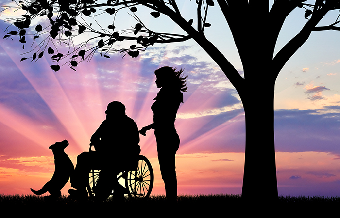 Concept of caring for a disabled person and house of aged